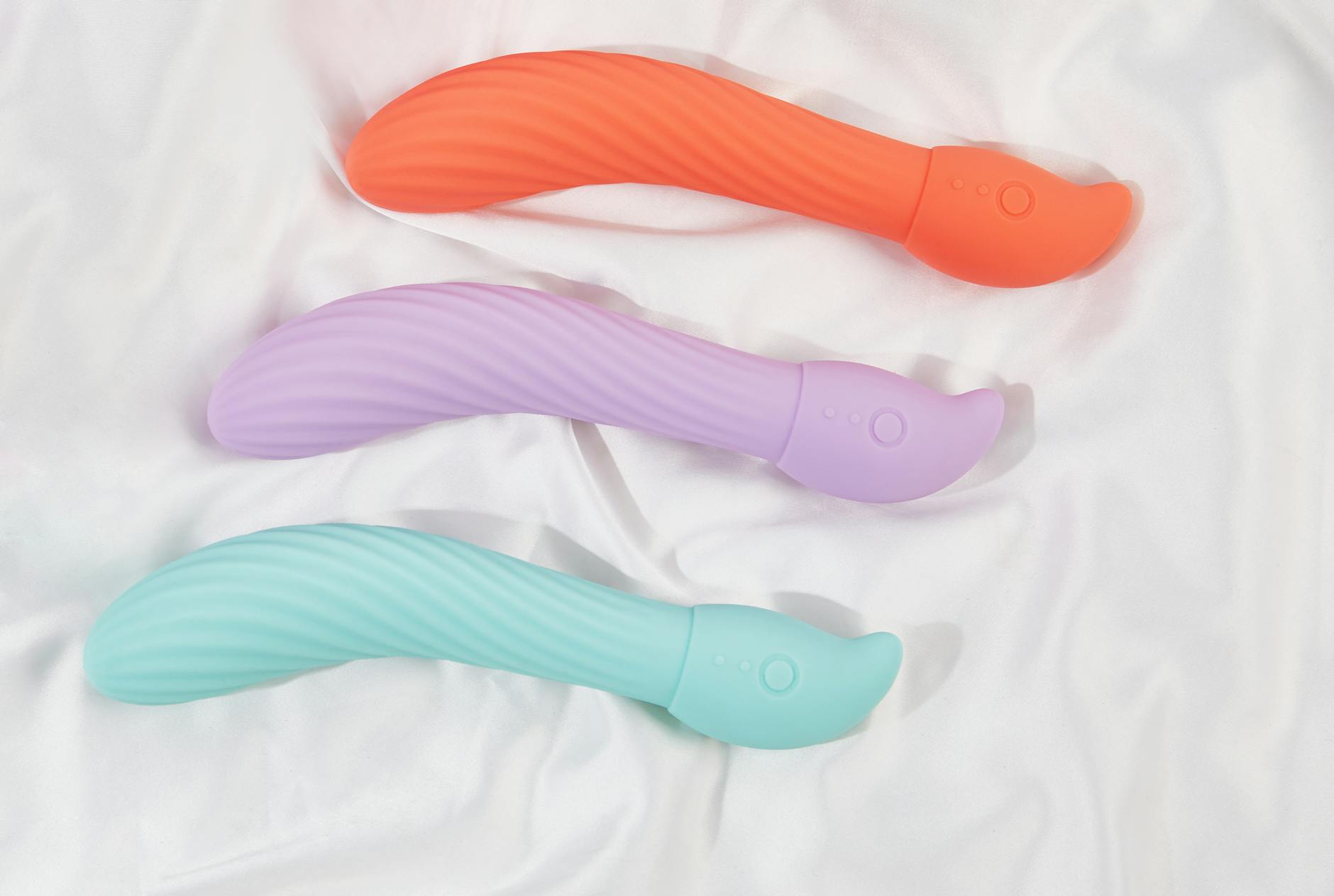 Vibrant collection of various sex toys on a bright yellow background, symbolizing diverse pleasure options